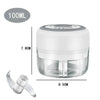 A clear plastic mini food chopper with a white lid and a silver blade attachment.