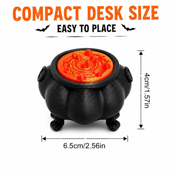 A black witch cauldron ornament with an orange interior, designed for a compact desk size.