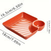 Orange serving plate with a divided section for appetizers or charcuterie.