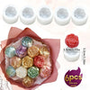 A set of six silicone molds shaped like roses in various pastel colors for baking