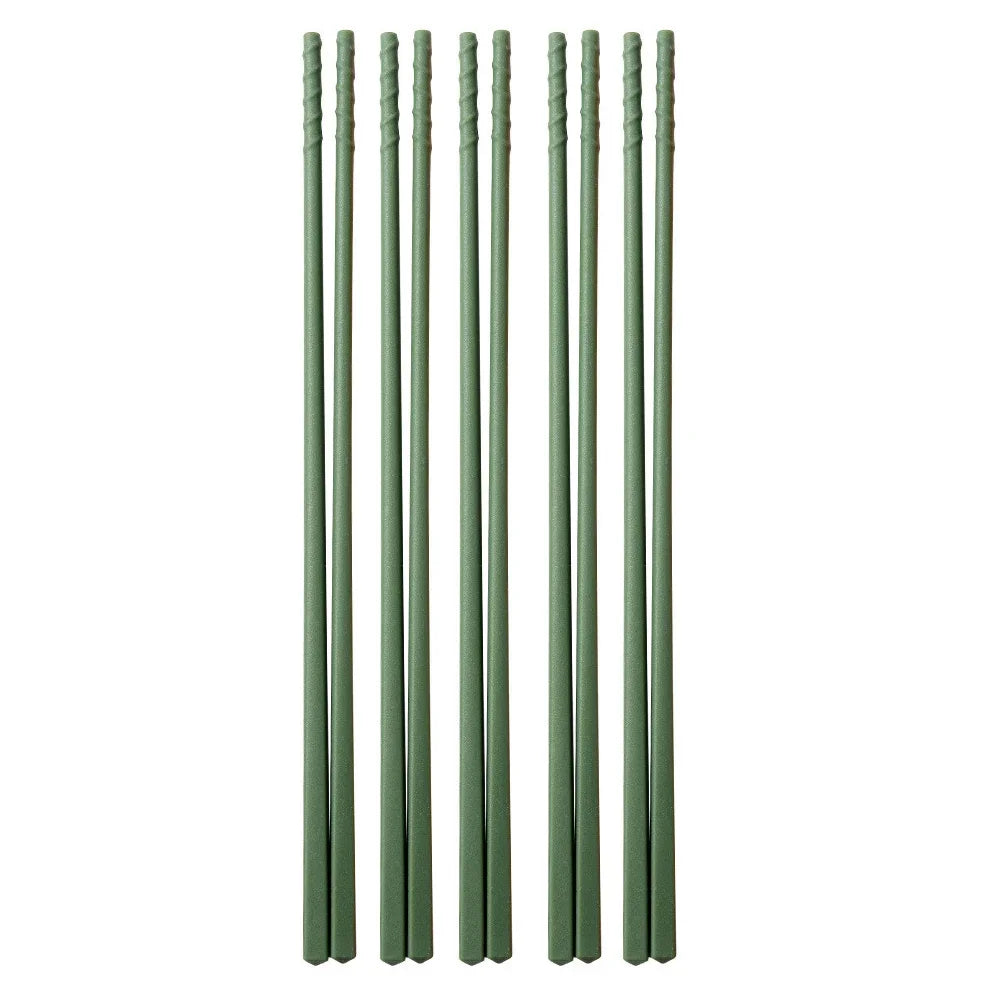 A set of green silicone chopsticks for noodles and sushi.