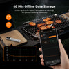 A hand holds a smartphone displaying temperature data while a mini Bluetooth meat thermometer is placed on a cutting board ne