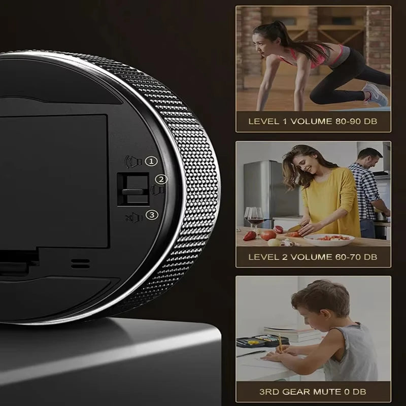 A close-up view of a black magnetic kitchen timer with a digital display and volume level indicators.