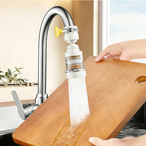A modern kitchen faucet with a filter attachment is shown dispensing water into a wooden cutting board.