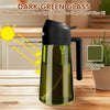 A dark green glass oil dispenser with a black pump is shown on a wooden table, demonstrating light protection for olive oil.