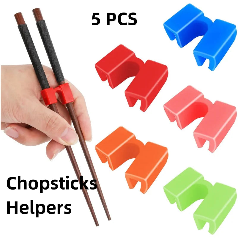 Five colorful plastic chopstick helpers are shown next to a hand, demonstrating reusable learning tools.