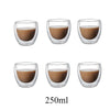 A set of six clear glass coasters filled with a brown liquid or oil.