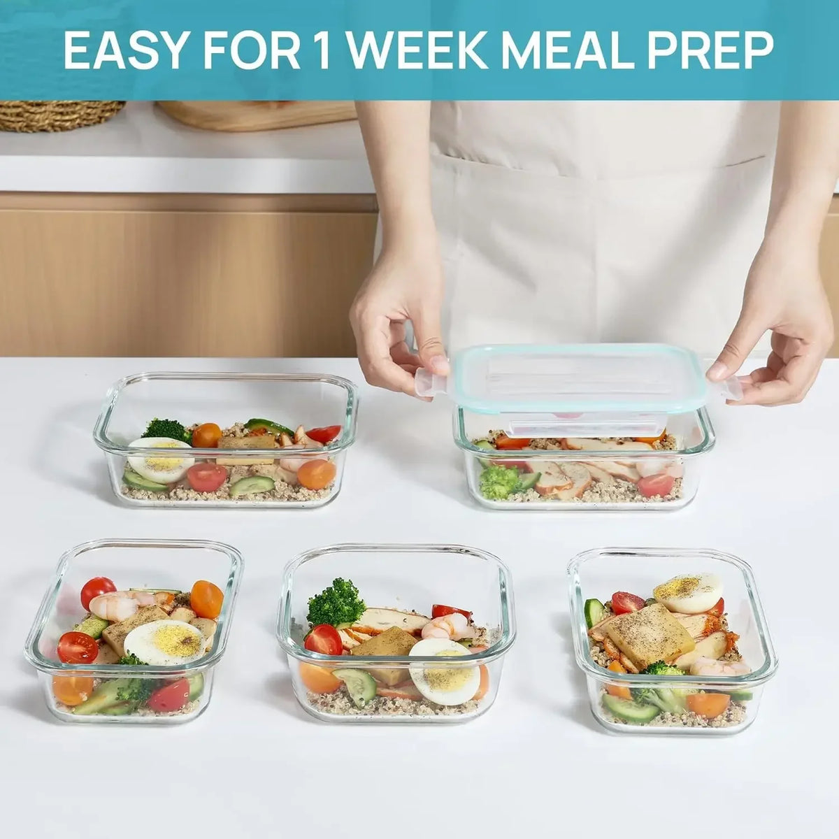 A hand is preparing to fill an airtight borosilicate glass lunch container with a meal for weekly meal prep.