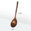 A wooden stirring spoon with a long handle and a rounded bowl, shown against a white background.