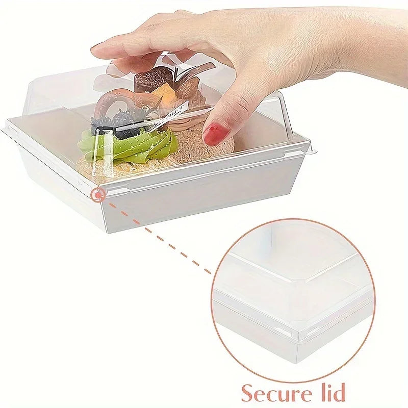 A hand is shown placing food items into a square clear plastic bread and sandwich packing box with a secure lid.