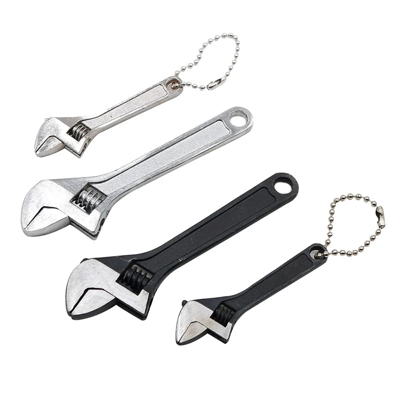 A set of two compact mini adjustable spanner wrenches with metal handles and chains.