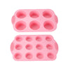 A pink silicone baking set with multiple round molds for cakes and desserts.