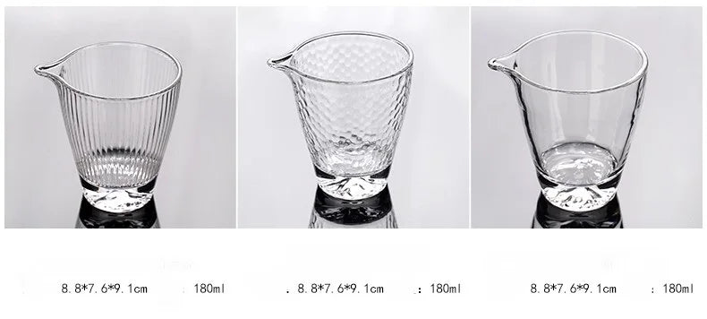 Three clear borosilicate glass tea cups of varying sizes displayed on a white background.