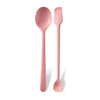 A pair of pink silicone heat resistant spoons for jam and rice.