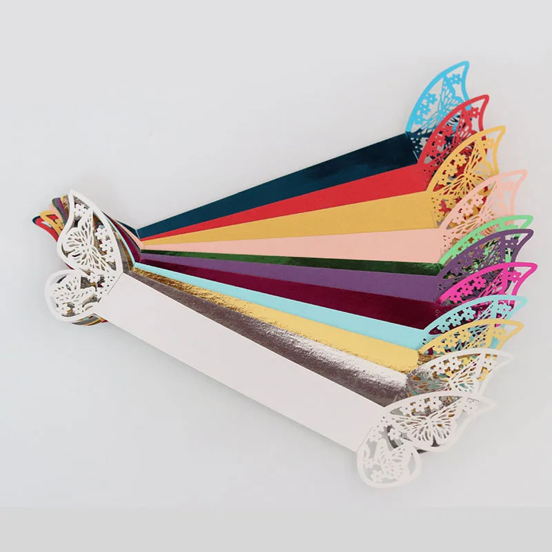 A display of 50 laser cut butterfly napkin rings in various colors arranged in a fan shape.