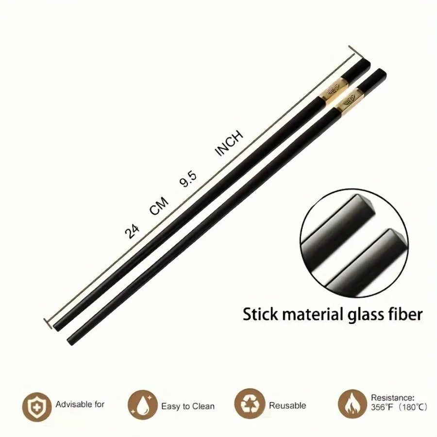 A set of black stick material glass fiber chopsticks shown diagonally with measurements and usage details.