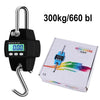 Black digital hanging crane scale with a hook and a white box showing capacity specifications.