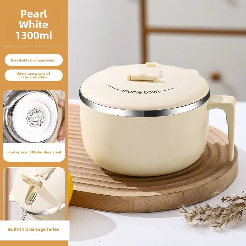 A cream-colored stainless steel noodle bowl with a lid and handle is shown on a wooden cutting board.