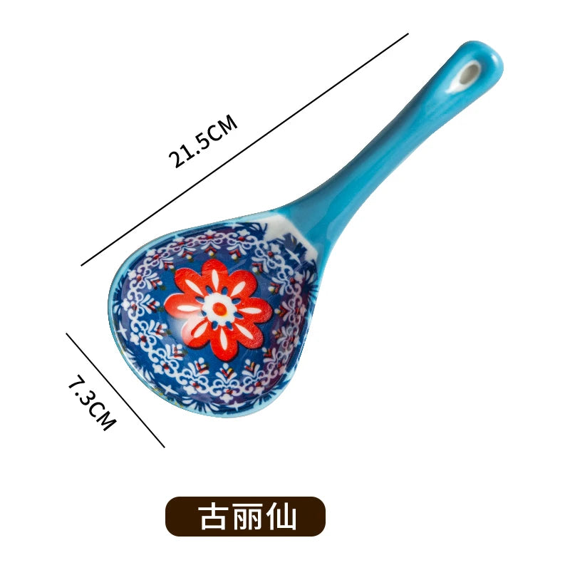 A blue ceramic ladle with a floral pattern, measuring 21.5cm in length and 7.3cm in width.