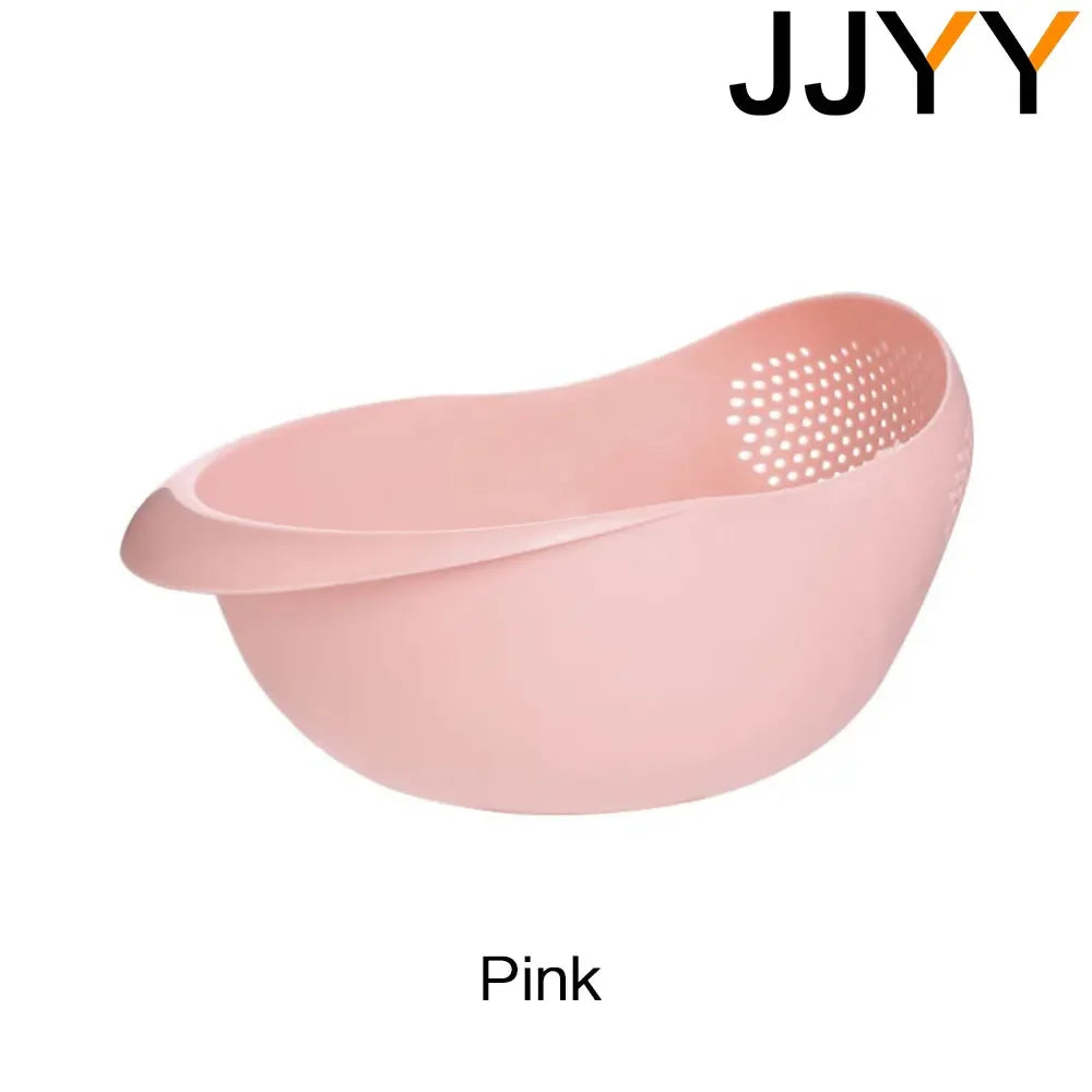 A pink multi-use kitchen drainer colander set with a perforated bottom.