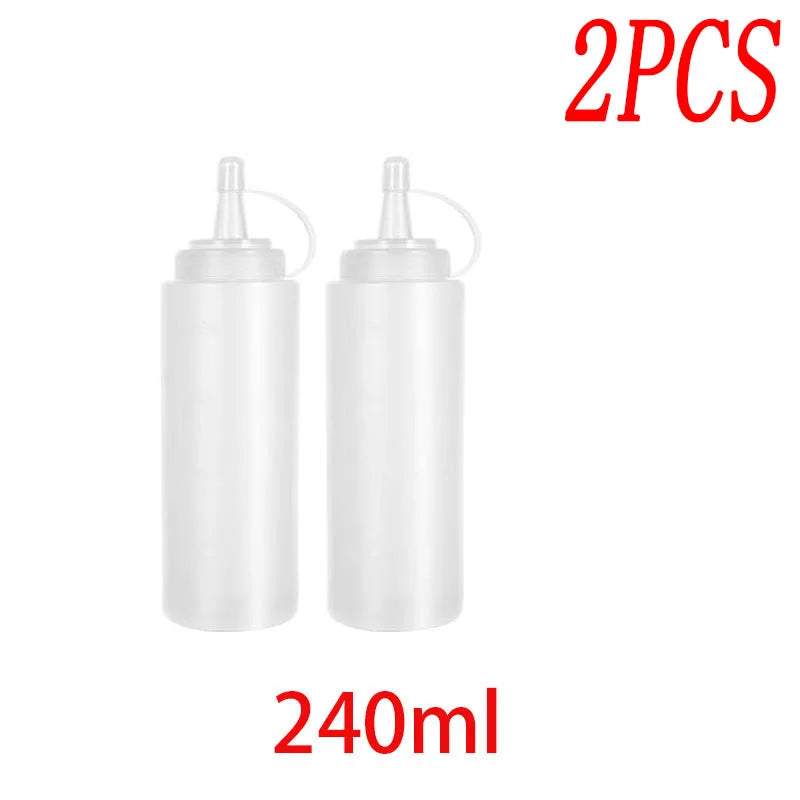 Two white multi-use squeeze condiment bottles with droppers, 240ml each.