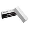 A white block of Dialux polishing compound with the brand name visible on the packaging.