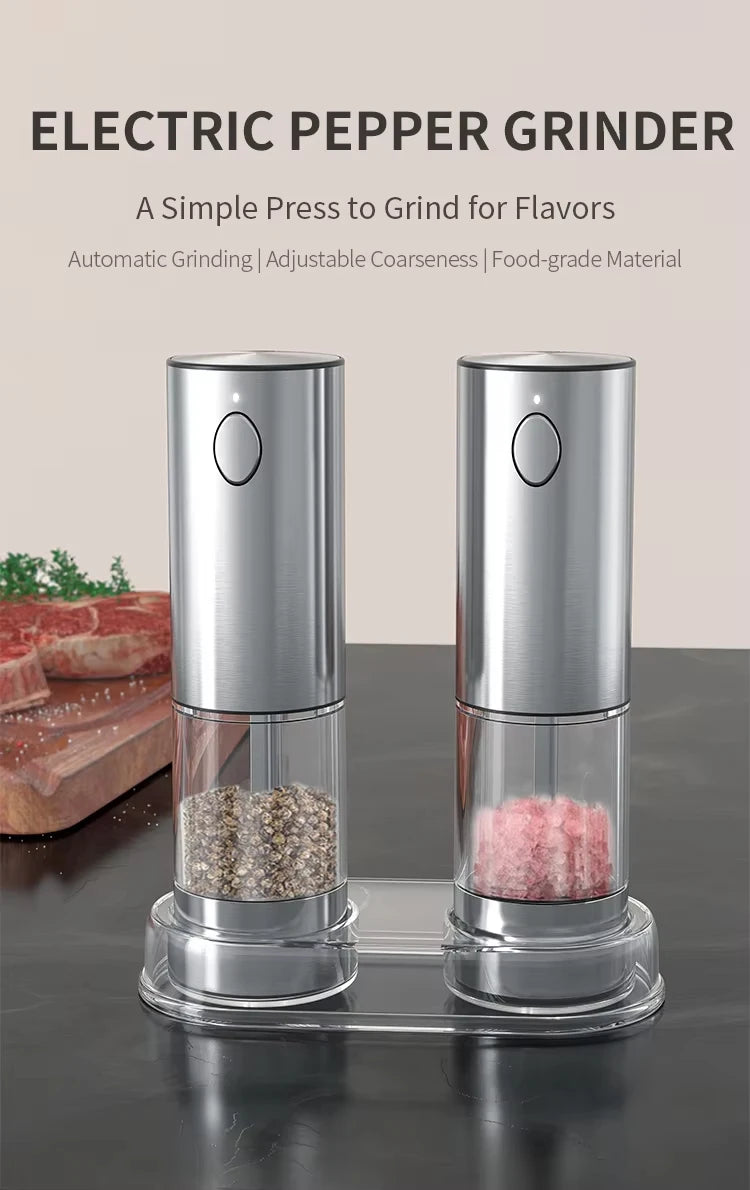 A set of electric pepper grinders with stainless steel bodies and glass jars filled with salt and pepper.