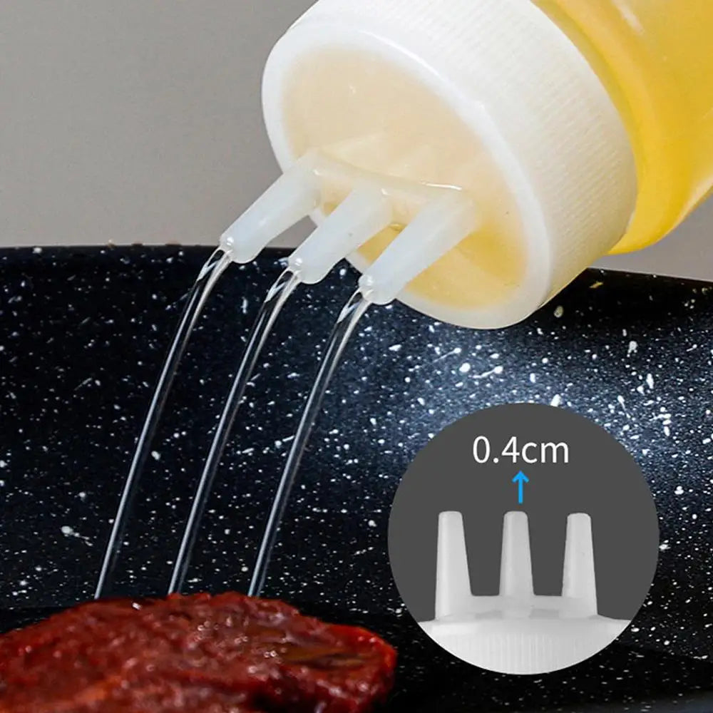 A squeeze bottle dispenser is dispensing liquid onto a piece of meat.