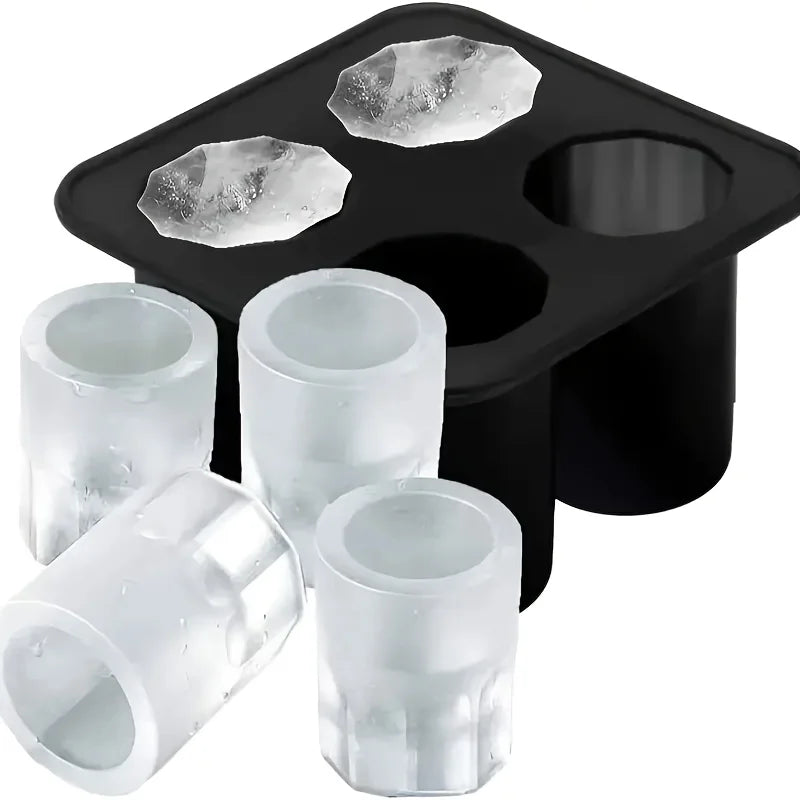 Black silicone ice cube molds with multiple cavities and several clear silicone molds.