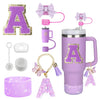 A set of purple silicone straw toppers and accessories for tumblers, including a large letter A and various decorative elemen