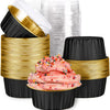 A set of black reusable aluminum foil baking cups with gold lids stacked and displayed.