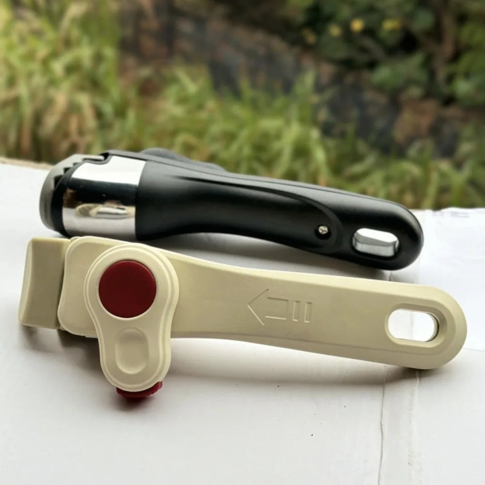 A beige detachable cookware handle clip with a red button and a black handle is shown on a white surface.