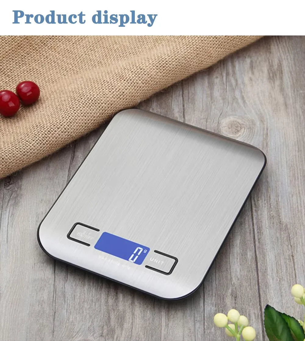 A stainless steel digital kitchen scale is displayed on a wooden surface next to some red berries.