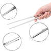 A hand holds a set of stainless steel BBQ and kitchen tongs, shown with various angles.