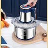 A hand is operating a 5L stainless steel electric meat grinder and food chopper for dough mixing.