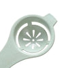 A white silicone multi-piece egg white and yolk separator set with a perforated design.