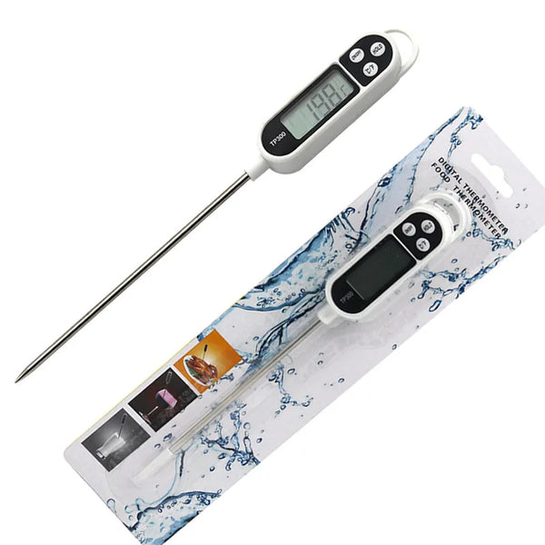 A white digital kitchen food thermometer with an instant read probe packaged in a clear plastic sleeve.