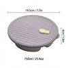 A round, purple lidded container with ribbed sides and a small yellow spoon inside.