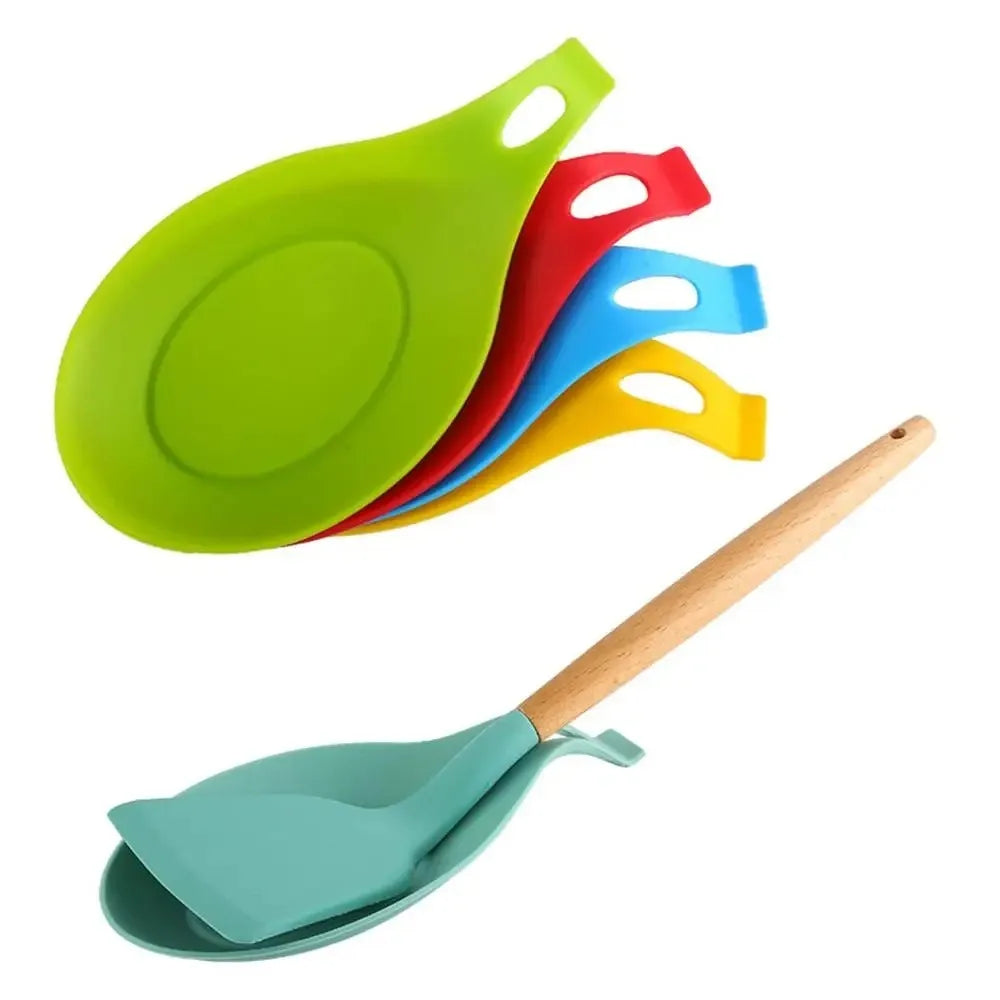 A silicone kitchen utensil holder rack with three colored silicone spoons and a wooden spatula.