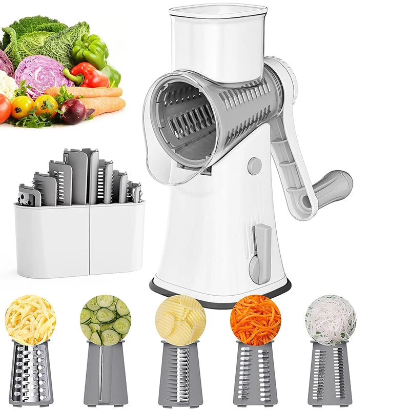 A white 5-in-1 rotary kitchen grater and slicer with multiple grating attachments shown alongside fresh vegetables.