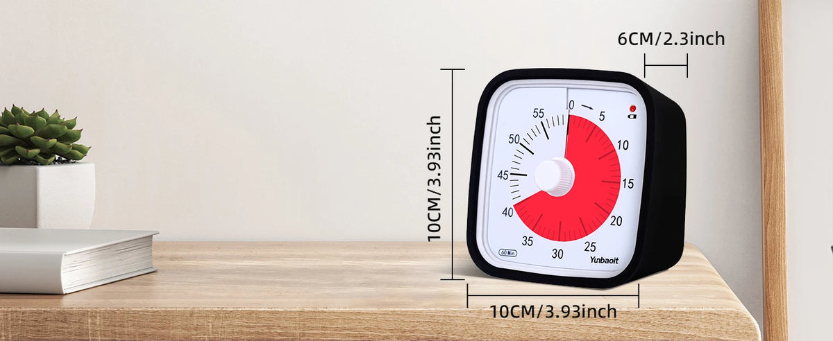 A black visual countdown timer for kids with a red dial and markings, displayed on a wooden surface.