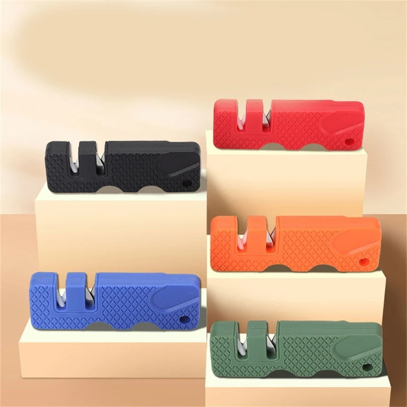 A collection of portable mini knife sharpeners in various colors, including red, black, orange, blue, and green, displayed on