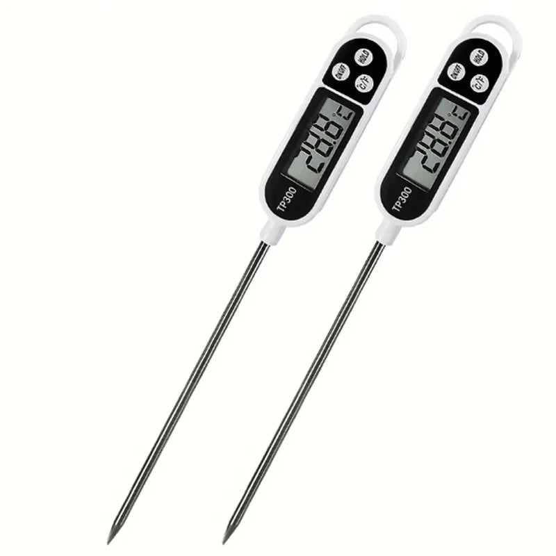 A pair of digital kitchen food thermometers with instant read probes displaying a temperature reading.