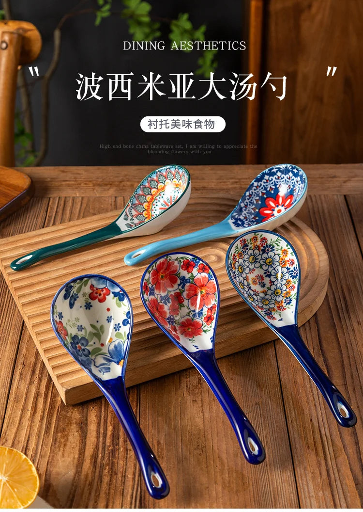 A set of five ceramic ladles in blue and white floral patterns displayed on a wooden surface.