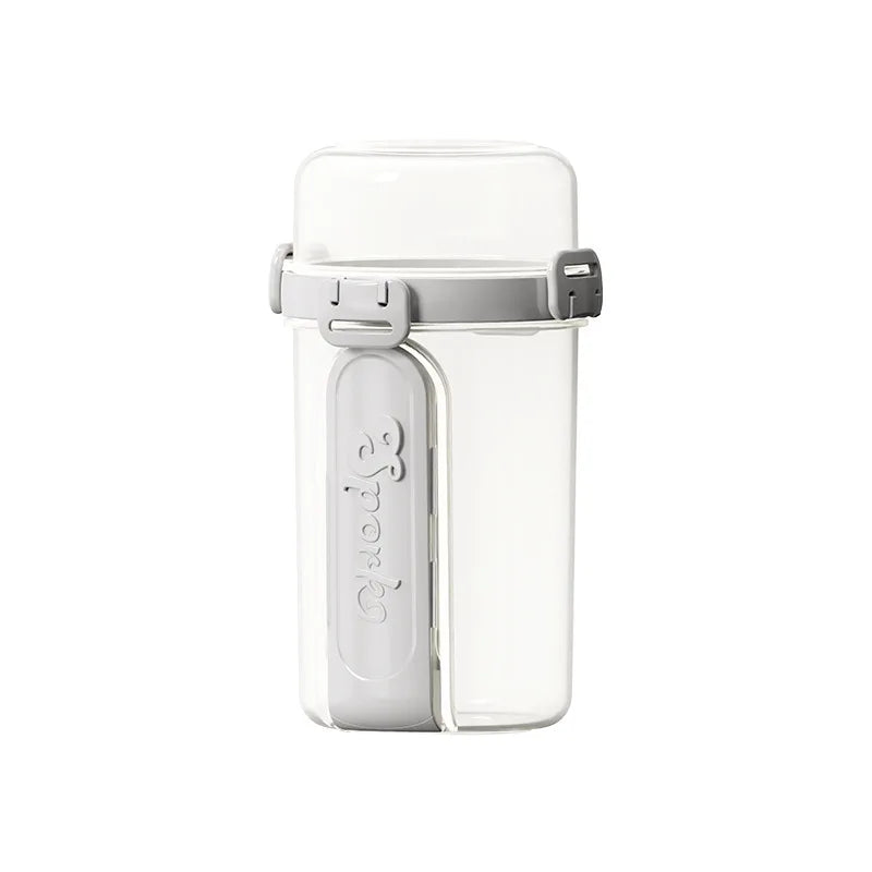 A clear double-layer container for overnight oats with a white leakproof lid.