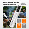 A white Inkbird INT-111-B Bluetooth meat thermometer is shown next to cooked meat on a grill.