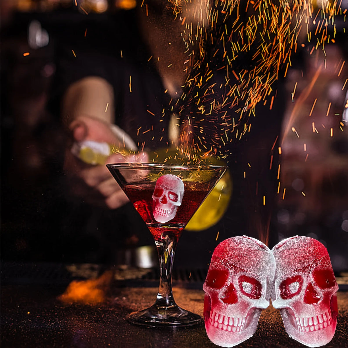 A cocktail glass filled with red liquid is being dusted with orange spice flakes, next to two silicone skull ice cube molds.