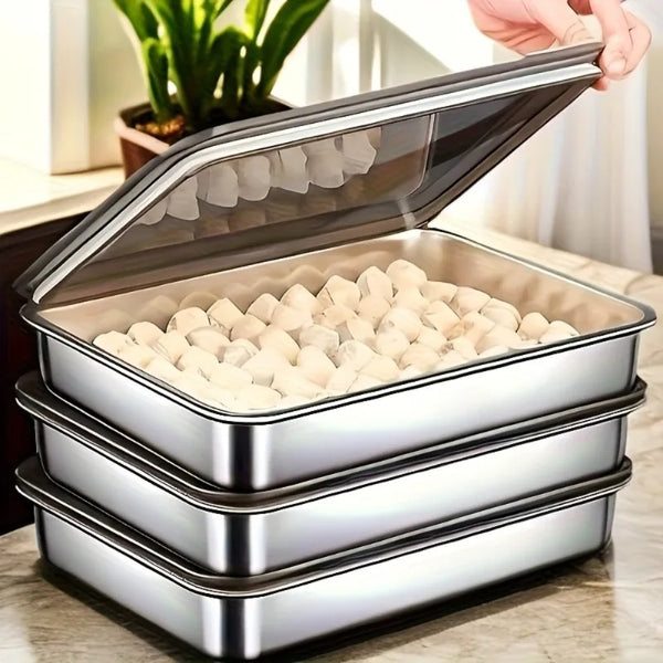 A stack of three non-stick stainless steel baking trays with lids shown open and closed.
