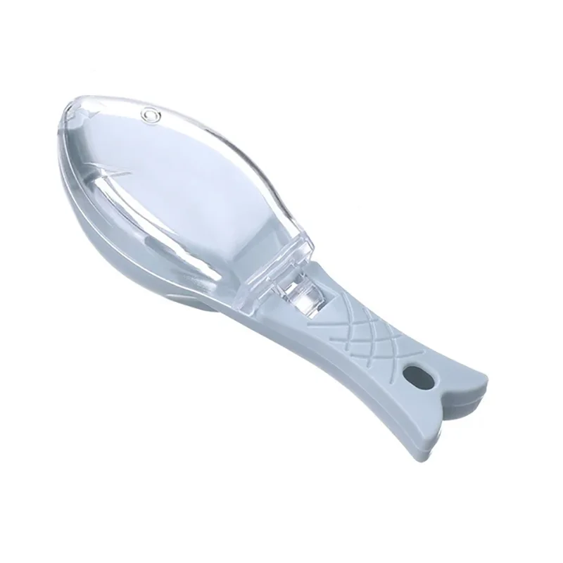 A clear plastic natural fish scale grater and scraper tool with a handle.