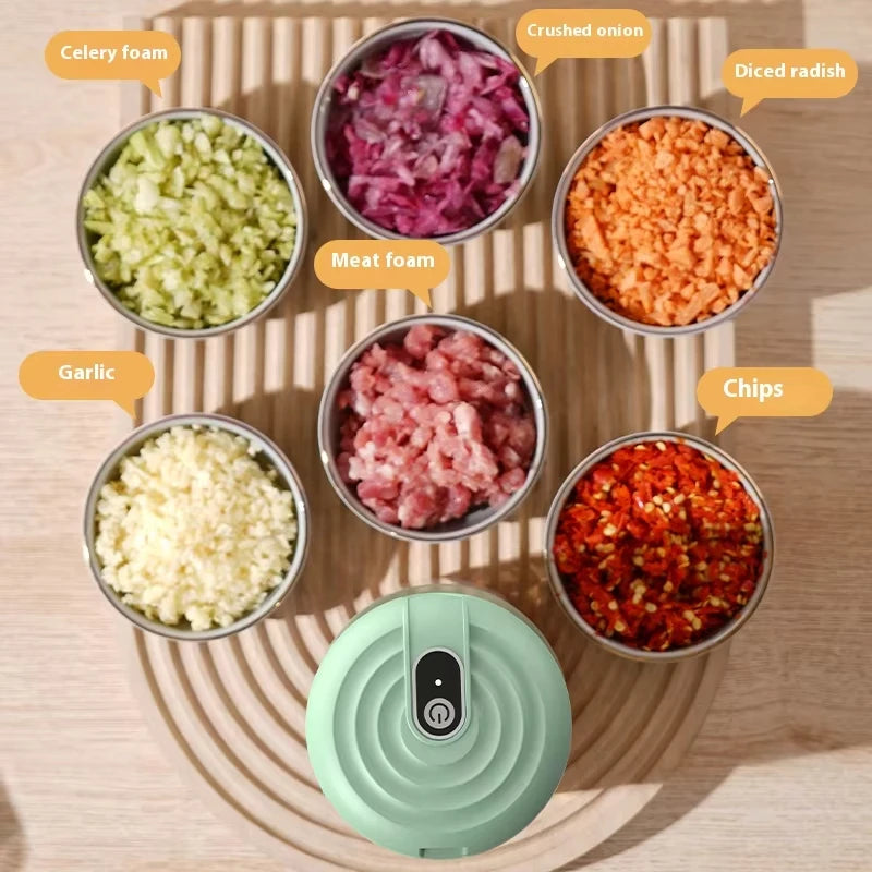 A collection of ground ingredients like celery foam, meat foam, garlic, onion, radish, and chips are displayed around an elec